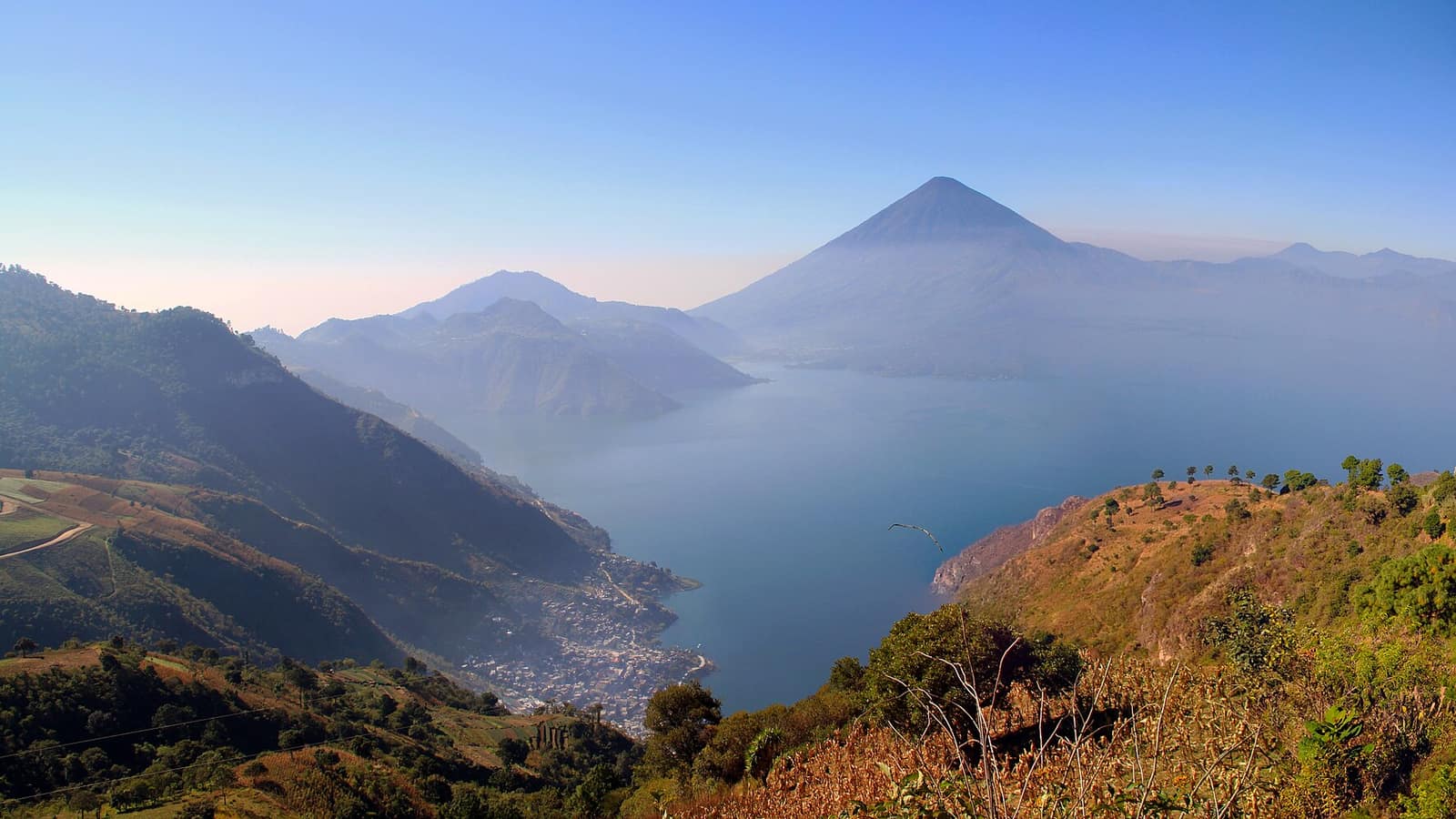Lake Atitlán from the north shore, with the volcanoes behind the lakeside villages